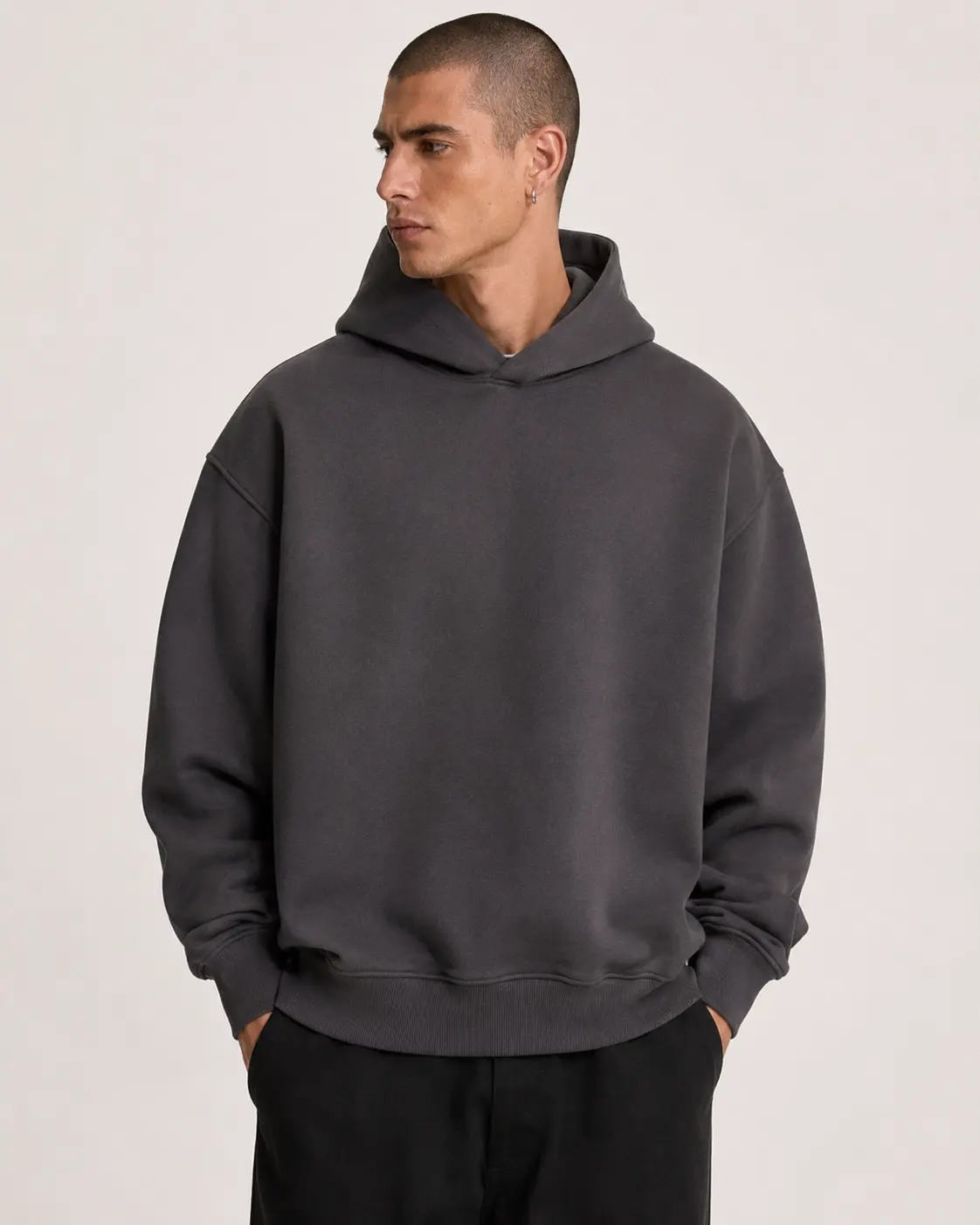 Oversized heavyweight hoodie with dropped shoulders and strong structure