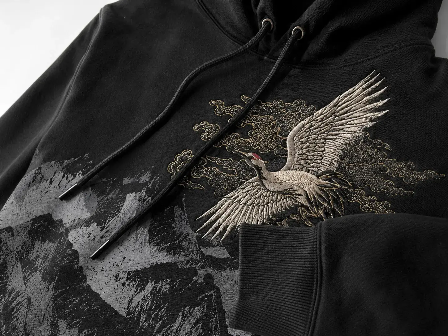 Mixed embroidery and print technique on custom graphic hoodie