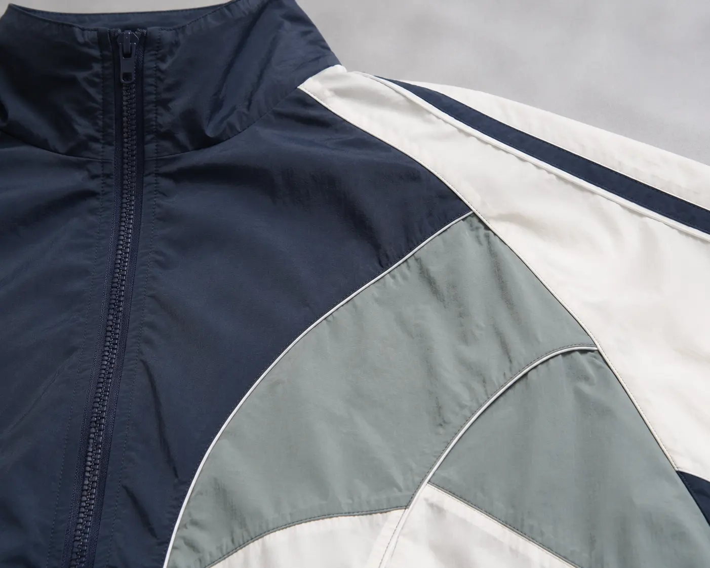 Color blocking and panel detail for custom nylon tracksuit