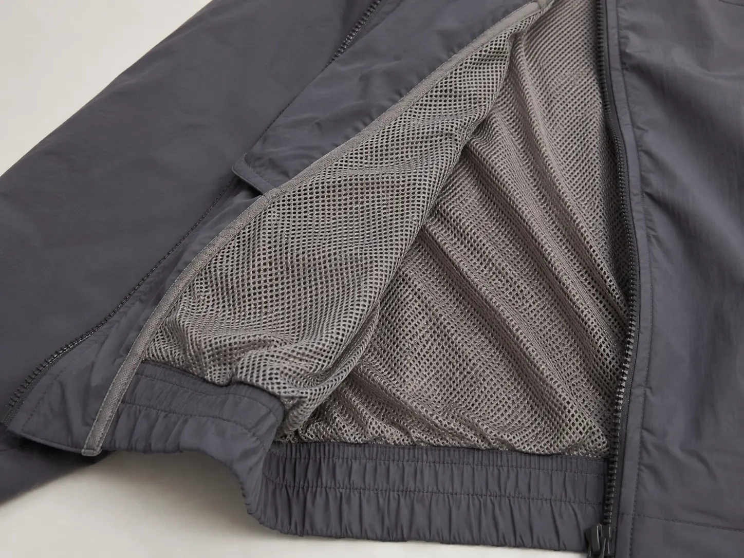 Mesh lining detail inside custom nylon tracksuit jacket