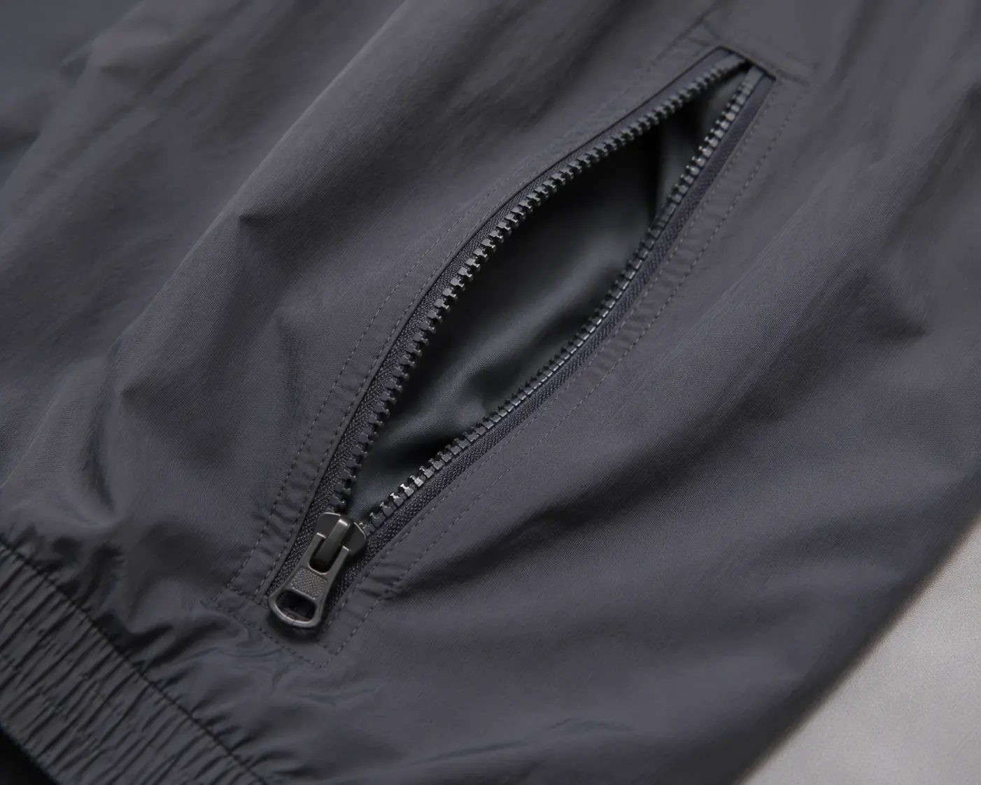 Zipper pocket detail for custom nylon tracksuit