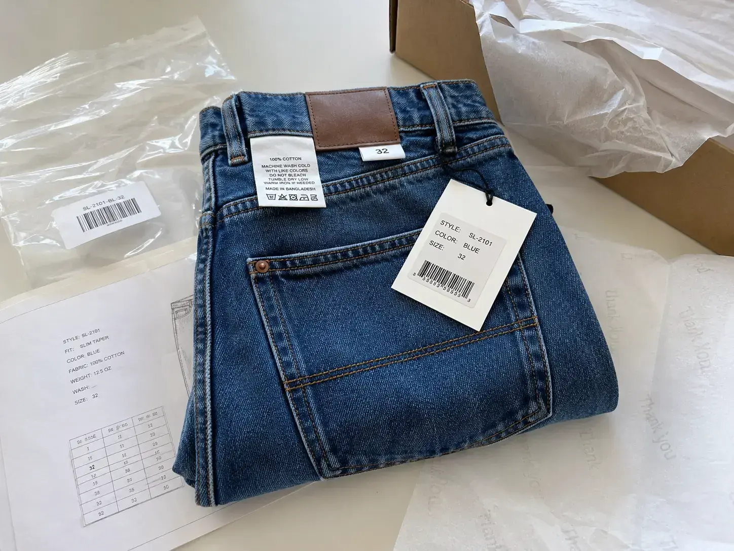 Private label custom denim jeans with labels tags hardware and packaging
