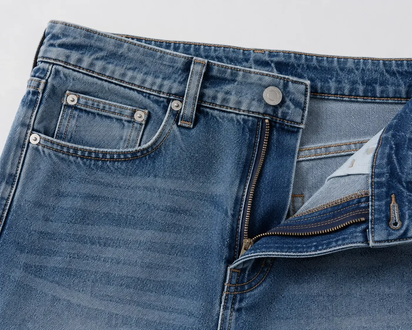 Pocket rivet button and hardware details for custom denim shorts