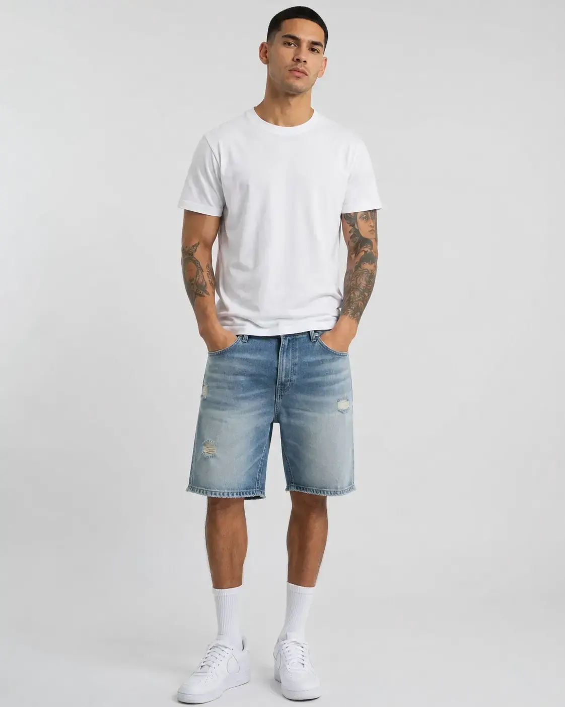 Custom washed and distressed denim shorts with faded effects